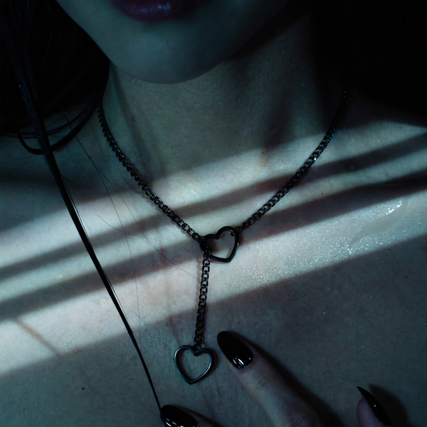 Heartstopper lariat worn on rain-wet skin