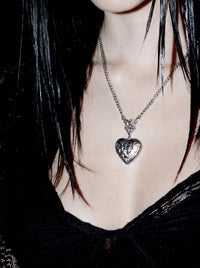 Model wearing the Till Death heart locket, close-up