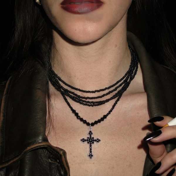 Congregation bead stack worn with leather jacket