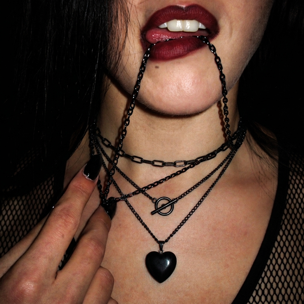 Three Stages Of Grief layered set worn, chain bite