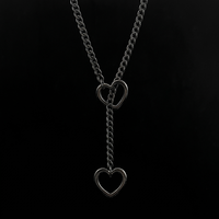 Heartstopper black heart lariat on black