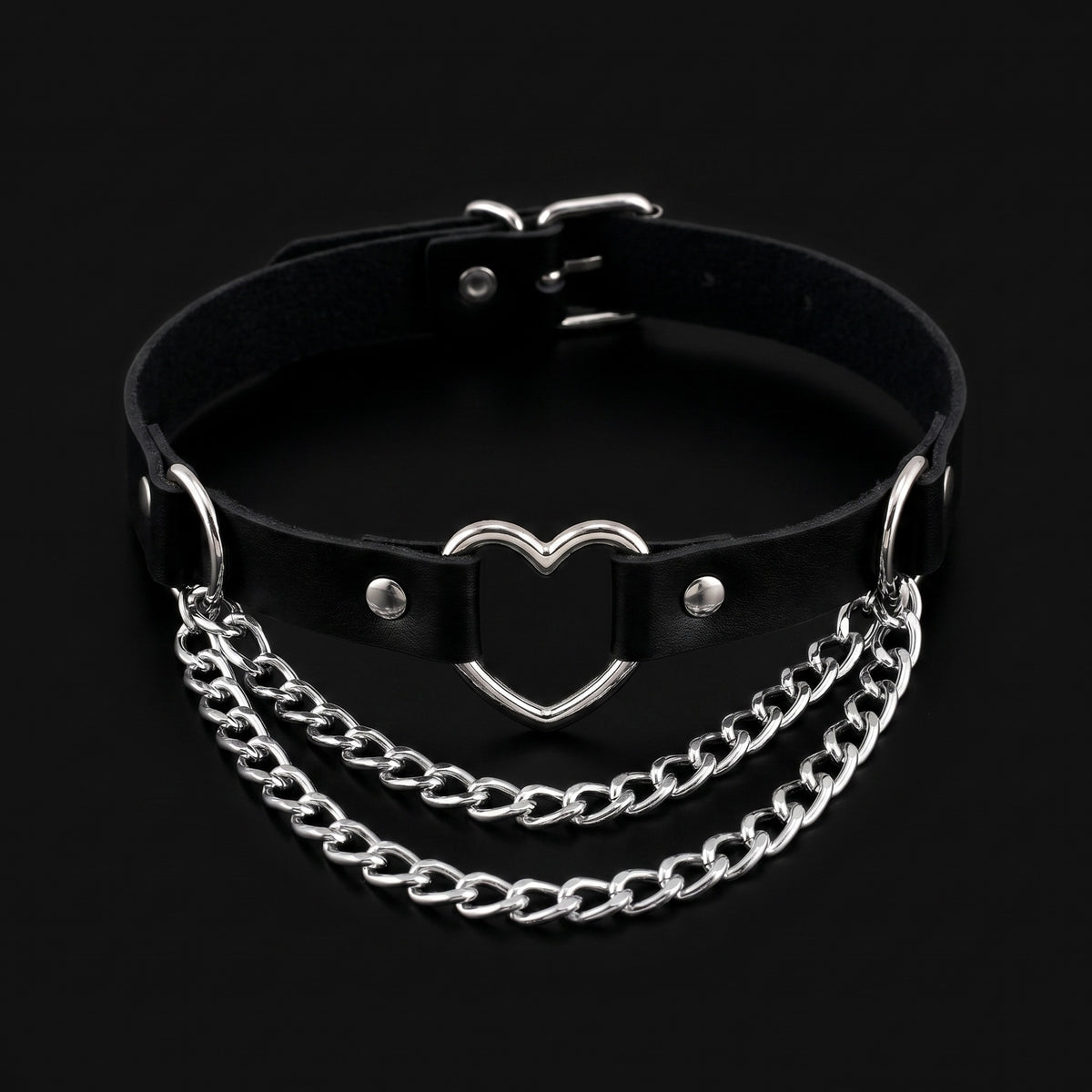 Black leather collar choker with silver heart ring and chain swags, black background