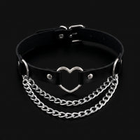Black leather collar choker with silver heart ring and chain swags, black background