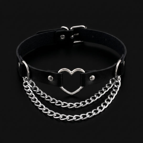 Black leather collar choker with silver heart ring and chain swags, black background